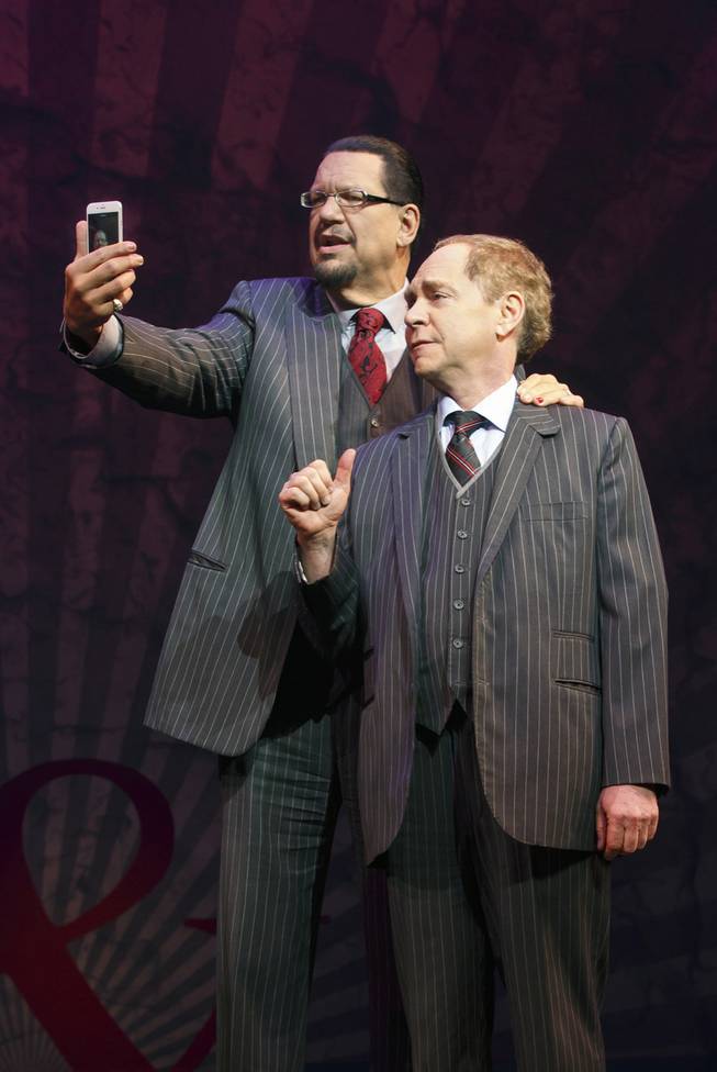 Penn Jillette and Teller perform in "Penn & Teller on Broadway," a six-week engagement playing at Marquis Theater in New York through Aug. 16, 2015. 