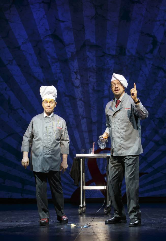 Penn Jillette, right, and Teller perform in "Penn & Teller on Broadway," a six-week engagement playing at Marquis Theater in New York through Aug. 16, 2015. 