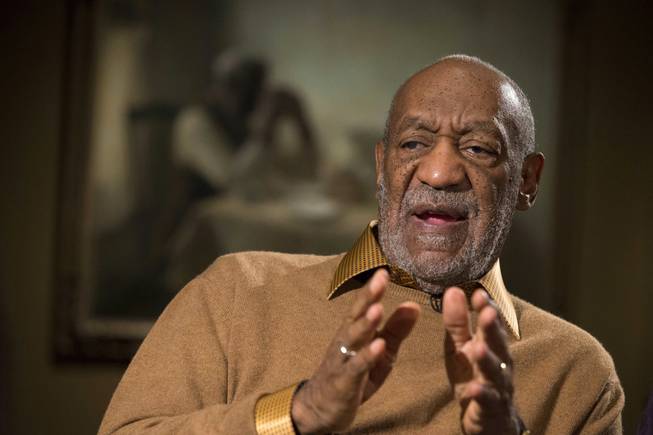 In this Nov. 6, 2014, file photo, entertainer Bill Cosby gestures during an interview at the Smithsonian's National Museum of African Art in Washington.