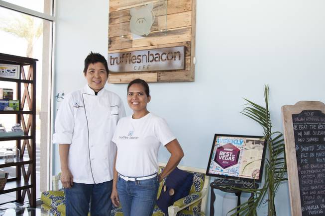 Owners, Chef Jacqueline Lim, left, and Magnolia Magat, right, pose for a photo in the waiting area of their restaurant Truffels N Bacon Cafe located in Henderson, NV, Thursday, July 16, 2015.