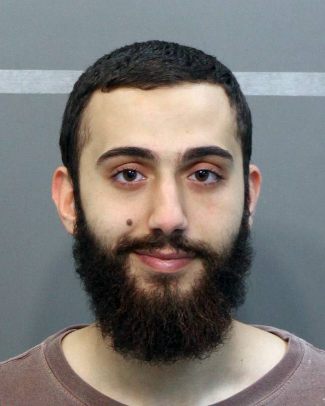 This April 2015 booking photo released by the Hamilton County Sheriff's Office shows a man identified as Mohammad Youssduf Adbulazeer after being detained for a driving offense. Abdulazeez, of Hixson, Tenn., attacked two military facilities on Thursday, July 16, 2015, in a shooting rampage that killed four Marines.