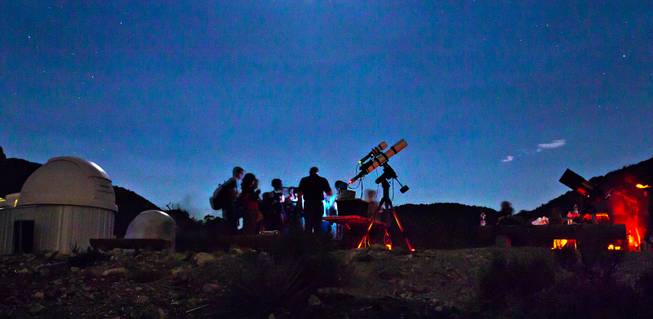 Las Vegas Astronomical Society member Rob Lambert instructs Boy Scouts as to what they will hopefully see in the telescopes at their camp on Mt. Potosi on Tuesday, June 23, 2015.