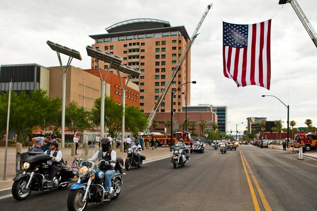 The 2015 Patriot Tour arrives at the Las Vegas City Hall with over 50 motorcycles along on Monday, July 20, 2015.