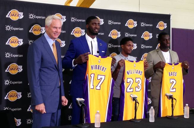 Los Angeles Lakers General Manager Mitch Kupchak introduces three NBA veterans, Roy Hibbert (17), Lou Williams (23) and Brandon Bass (2), during a news conference in El Segundo, Calif., on Wednesday, July 22, 2015. Hibbert is a two-time NBA All-Star center eager to revitalize his career after seven seasons in Indiana while Williams was the Sixth Man of the Year with Toronto last season. 