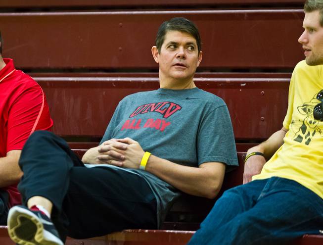 UNLV coach Dave Rice chats with Las Vegas Sun sports reporter Taylor Bern as they watch Team Melo play play the EP Elite during the Bigfoot Hoops Las Vegas Classic at Eldorado High School on Thursday, July 23, 2015.