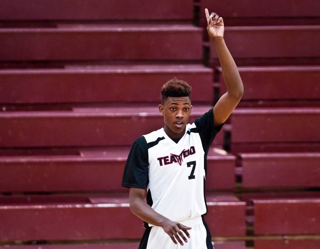 Andre Rafus (7) from Team Melo signals for a pass during the Bigfoot Hoops Las Vegas Classic at Eldorado High School on Thursday, July 23, 2015.