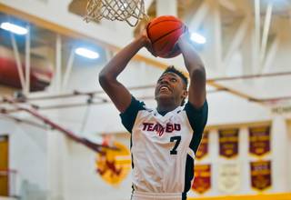 Andre Rafus (7) of Team Melo elevates for a dunk during the Bigfoot Hoops Las Vegas Classic at Eldorado High School on Thursday, July 23, 2015.