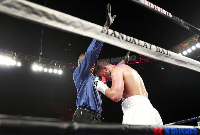 Referee Kenny Bayless stops the fight after Nadjib Mohammedi of France was knocked out by WBA/IBF/WBO light heavyweight champion Sergey Kovalev of Russia during their light heavyweight title fight at the Mandalay Bay Events Center Saturday, July 25, 2015. Kovalev won with a third-round knockout.
