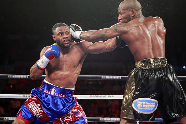 Jean Pascal, left, of Canada connects on Yunieski Gonzalez of Cuba during their light heavyweight fight at the Mandalay Bay Events Center Saturday, July 25, 2015.