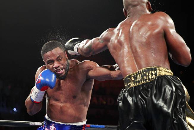 Jean Pascal, left, of Canada gets hit by a punch from Yunieski Gonzalez of Cuba during their light heavyweight fight at the Mandalay Bay Events Center Saturday, July 25, 2015.