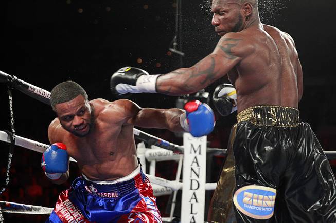 Jean Pascal, left, of Canada punches Yunieski Gonzalez of Cuba during their light heavyweight fight at the Mandalay Bay Events Center Saturday, July 25, 2015.