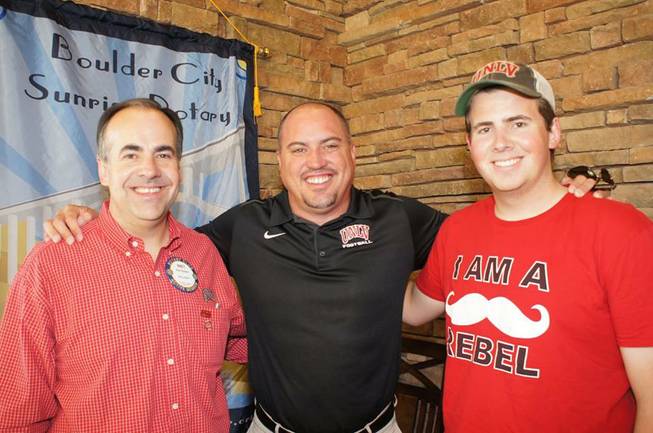 UNLV football coach Tony Sanchez with members of the Boulder City Sunrise Rotary Club after speaking to the group this spring.