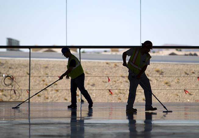 Workers finish a concrete floor on the Ikea Las Vegas store at Durango Drive and Sunset Road Tuesday, July 28, 2015. The store is expected to open in the summer of 2016.
