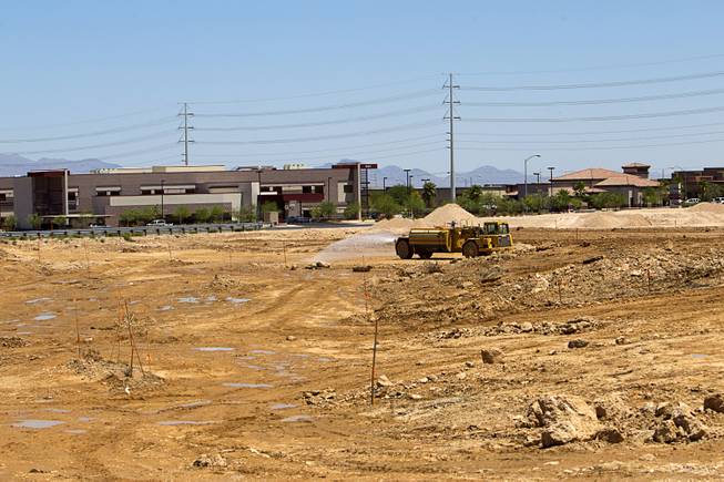 A water truck keeps the dust down at a DR Horton residential development north of the Ikea Las Vegas construction siteTuesday, July 28, 2015.