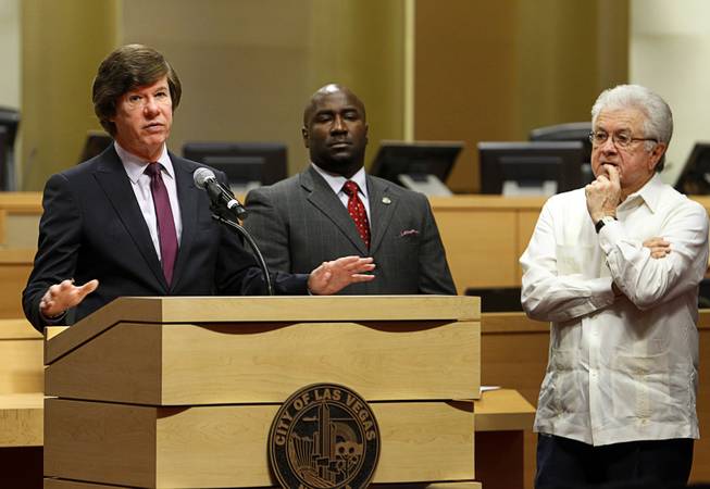 City Attorney Brad Jerbic speaks during a news conference as City Councilmen Ricki Barlow, center, and Bob Coffin listen at Las Vegas City Hall Wednesday, July 29, 2015. The city unveiled a proposed ordinance that would regulate street performers at the Fremont Street Experience in downtown Las Vegas.