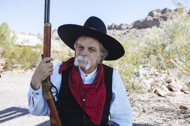 Nevada Jack, Mario Amabile, sits on a stump in Nelson, Nevada on July 25, 2015.