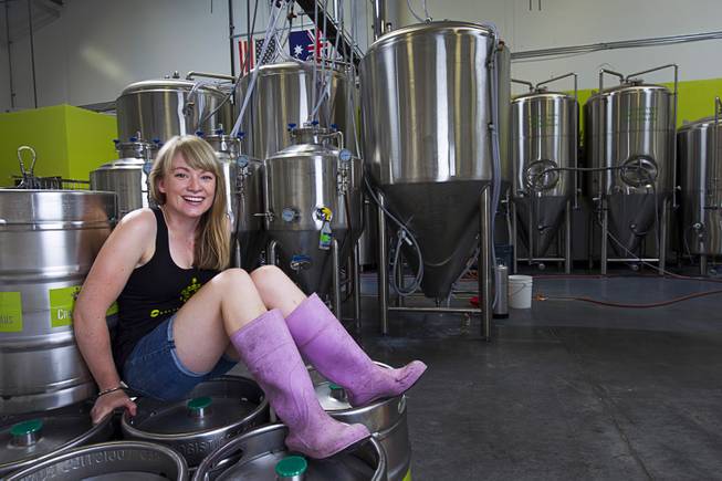 Brewer Steph Cope poses at the CraftHaus Brewery in Henderson's Booze District Sunday Aug. 2, 2015.