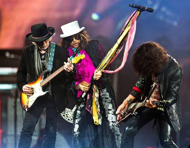 Aerosmith guitarist Brad Whitford, lead singer Steven Tyler and lead guitarist Joe Perry perform Saturday, Aug. 1, 2015, at MGM Grand Garden Arena.