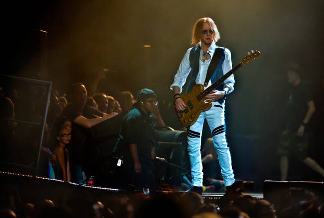 Aerosmith bass guitarist Tom Hamilton performs with the band Saturday, Aug. 1, 2015, at MGM Grand Garden Arena.