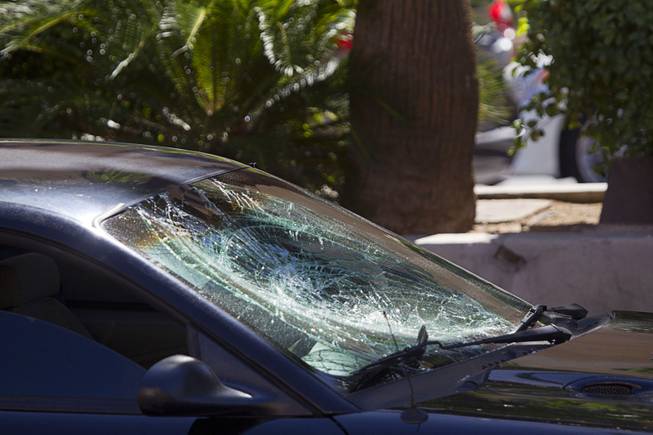The windshield of a Ford Mustang is shown after an accident with a bicyclist on the Las Vegas Strip in front of the Treasure Island Aug. 3, 2015. The southbound lanes of Las Vegas Boulevard in front of Treasure Island are closed during the investigation.