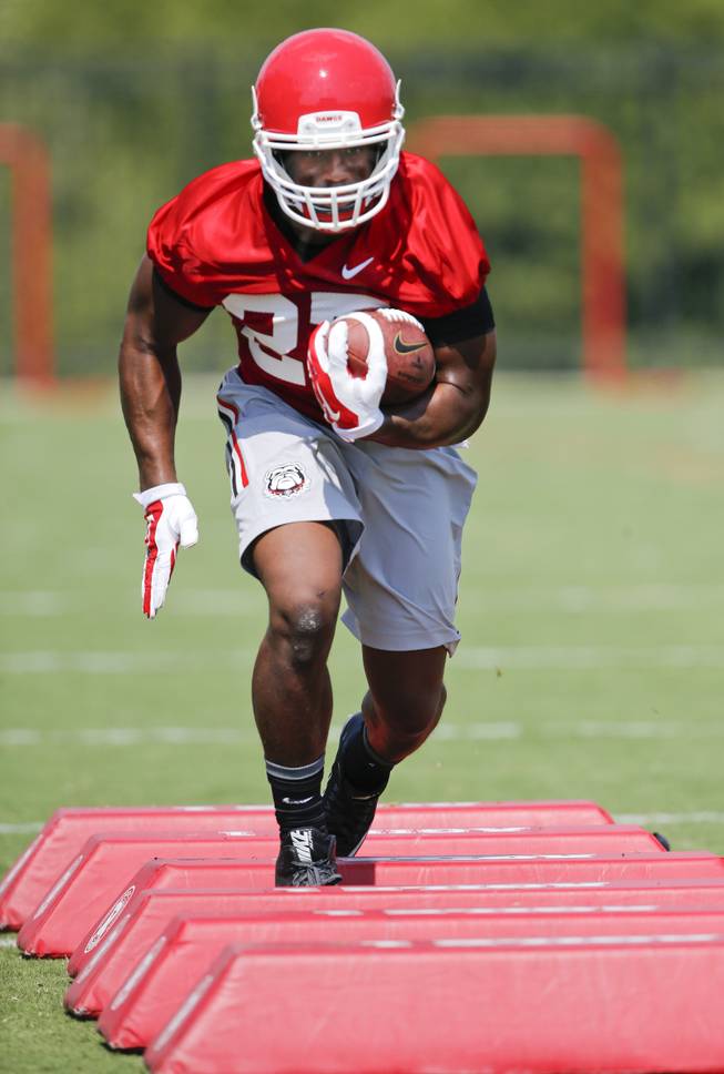 Georgia running back Nick Chubb (27) runs a drill during NCAA college football practice, Tuesday, Aug. 4, 2015, in Athens, Ga.