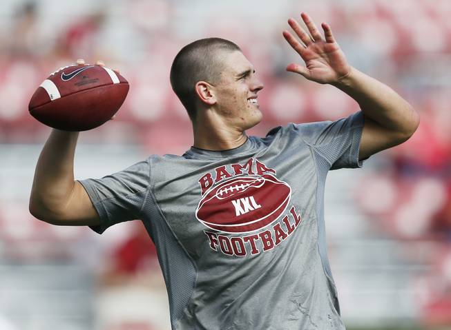Alabama quarterback Jake Coker (14) warms up before an NCAA college football game against Southern Mississippi on Saturday, Sept. 13, 2014, in Tuscaloosa, Ala.