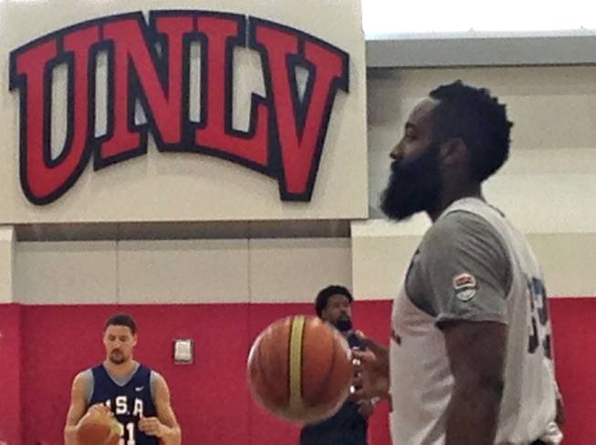 NBA guard James Harden dribbles through a shooting line during USA Basketball practice on Tuesday, Aug. 11, 2015, at the Mendenhall Center. UNLV recently put up new signs and logos in Mendenhall, including the "UNLV" in raised lettering behind Harden.