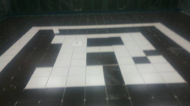 The flooring in the Rancho High football locker room was ripped out and replaced with new porcelain black tiles. In the middle of the room is ‘R’ in white tiles. 