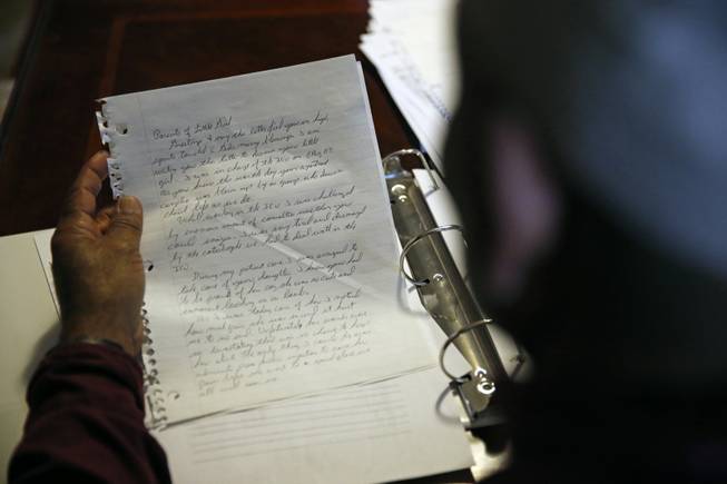 Retired U.S. Army Sgt. 1st Class Marshall Powell sits at his home in Crescent, Okla., on March 16, 2015, reading a letter he wrote to the parents of an Iraqi girl who died right in front of him after an attack. Powell is recovering from a condition diagnosed as "moral injury" and wrote the letter as part of his therapy.