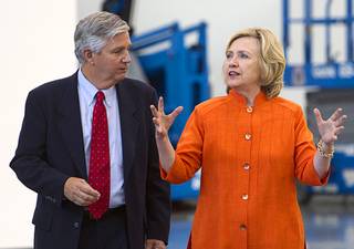 Democratic presidential candidate and former Secretary of State Hillary Rodham Clinton talks with Bill Irwin Jr., executive director of the Carpenters International Training Fund, during a tour of the Carpenters International Training Center Tuesday, Aug. 18, 2015.