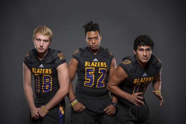 Durango football players Troy Smidt, Kenny Miller, and Seth Garcia before the 2015 Season.