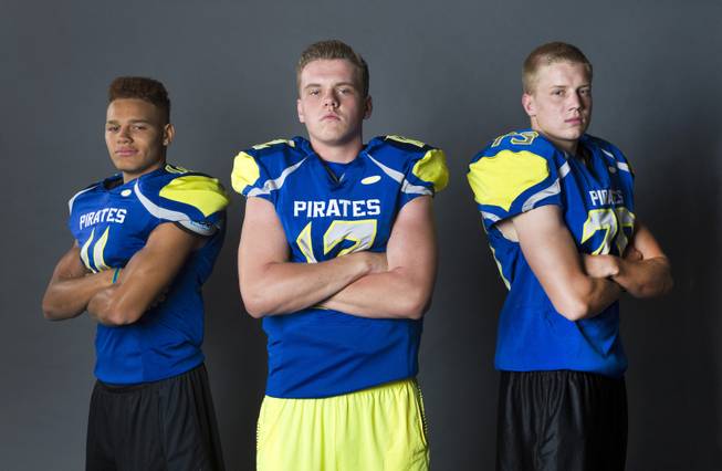 Moapa Valley Pirates, from left, RJ Hubert (11), Nate Cox (12), and Dennis Whitmore (75) during Las Vegas Sun's High School Football media day, Monday, July 27, 2015.