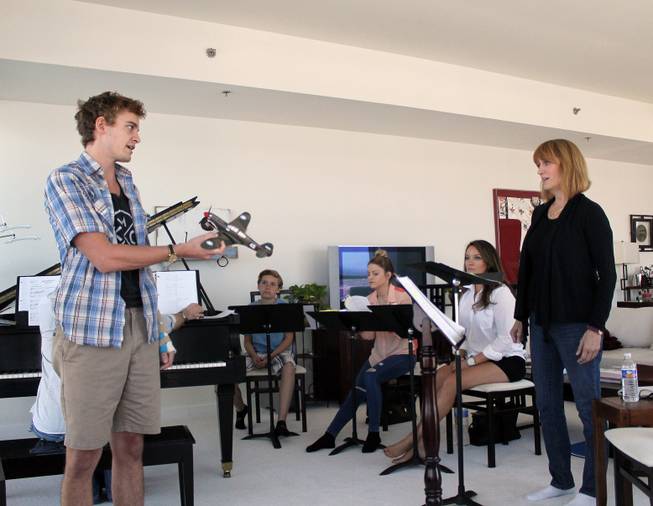 Sam Cordes and Tina Walsh rehearse Sunday, Aug. 9, 2015, for the musical “Ace” in the Panorama Towers home of the production’s co-writer and composer, Richard Oberacker. Also shown are cast members Niki Scalera, Nicole Kaplan and Gary Easton.