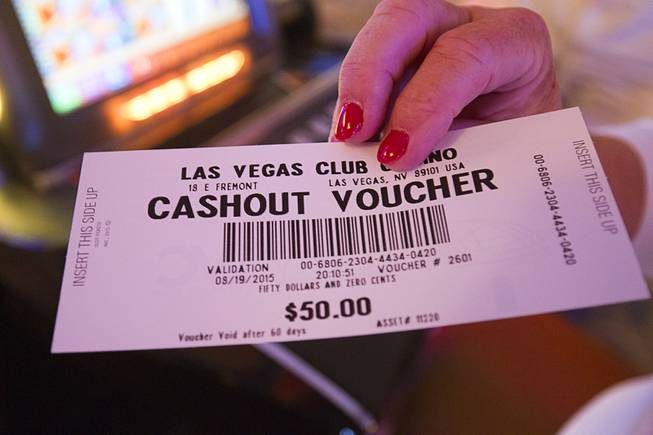 Nancy Burke of Dallas, Penn. displays a voucher during the last night of the Las Vegas Club in downtown Las Vegas Wednesday, Aug. 19, 2015.