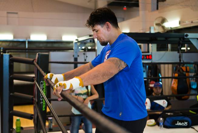 UFC fighter Frank Mir takes a moment out in the ring during training at Hybrid Performance in preparation for his Labor Day weekend fight in the co-main event of UFC 191 against Andrei Arlovski on Friday, August 14, 2015.