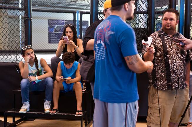 UFC fighter Frank Mir, right, talks with members of the media joined by his wife Jennifer, son Kage, 9, and daughter Isabella, 12, before a training session at Hybrid Performance on Friday, August 14, 2015.