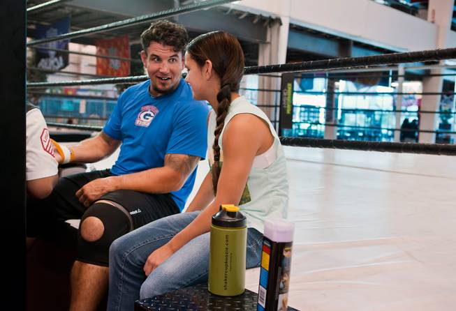 UFC fighter Frank Mir chats with his daughter Isabella, 12, while having his hands taped for training at Hybrid Performance in preparation for his Labor Day weekend fight in the co-main event of UFC 191 against Andrei Arlovski on Friday, August 14, 2015.