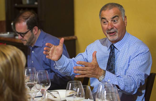 Restaurant owner Gino Ferraro speaks to guests during a Taste & Learn wine event at Ferraro's Italian Restaurant & Wine Bar, 4480 Paradise Rd., Saturday, Aug. 22, 2015.