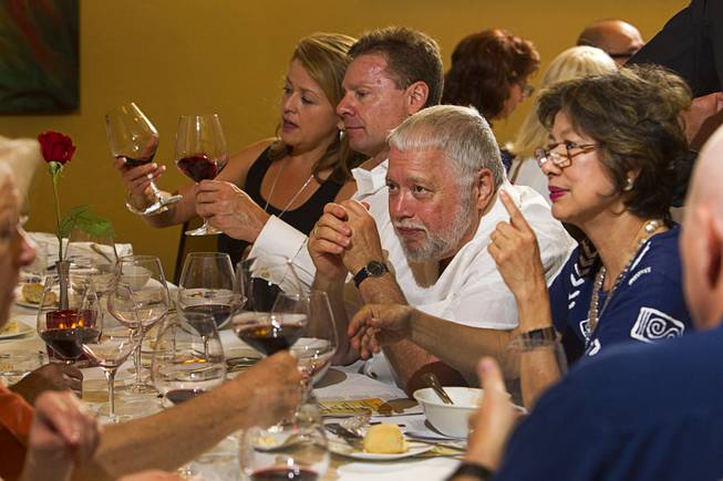 Guests discuss wine and food during a Taste & Learn wine event at Ferraro's Italian Restaurant & Wine Bar, 4480 Paradise Rd., Saturday, Aug. 22, 2015.