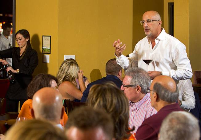 Giovanni Nencini, managing director of Lux Wines, speaks during a Taste & Learn wine event at Ferraro's Italian Restaurant & Wine Bar, 4480 Paradise Rd., Saturday, Aug. 22, 2015.