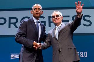 President Barack Obama poses with Senate Minority Leader Harry Reid (D-Nev) after Obama's keynote address during the National Clean Energy Summit 8.0 at the Mandalay Bay Convention Center Monday, Aug. 24, 2015.