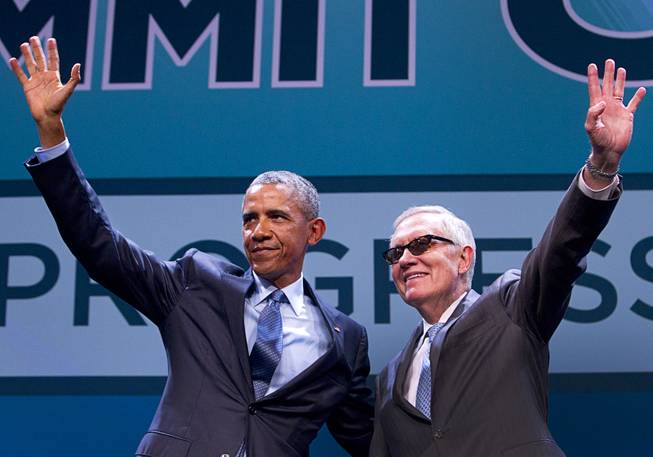 President Barack Obama and Senate Minority Leader Harry Reid wave to the audience after Obama’s keynote address during the National Clean Energy Summit 8.0 on Monday, Aug. 24, 2015, at Mandalay Bay Convention Center.