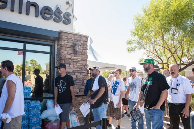 Dozens of customers wait in line to purchase marijuana on Monday, Aug. 24, 2015, opening day of Euphoria Wellness, the first marijuana dispensary in Las Vegas.