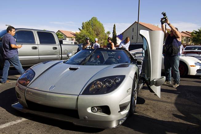 A photographer takes a photo of Floyd Mayweather Jr.'s new $4.8 million Koenigsegg CCXR Trevita at the Mayweather Boxing Club Wednesday, Aug. 26, 2015. Mayweather will defend his WBC and WBA welterweight titles against Andre Berto on Sept. 12 at the MGM Grand Garden Arena.