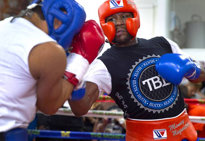Floyd Mayweather Jr., right, punches at Ramon Montano during a sparring session at the Mayweather Boxing Club Wednesday, Aug. 26, 2015. Mayweather will defend his WBC and WBA welterweight titles against Andre Berto on Sept. 12 at the MGM Grand Garden Arena.