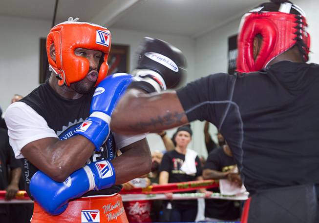 Floyd Mayweather Jr. spars with Don Moore at the Mayweather Boxing Club Wednesday, Aug. 26, 2015. Mayweather will defend his WBC and WBA welterweight titles against Andre Berto on Sept. 12 at the MGM Grand Garden Arena.