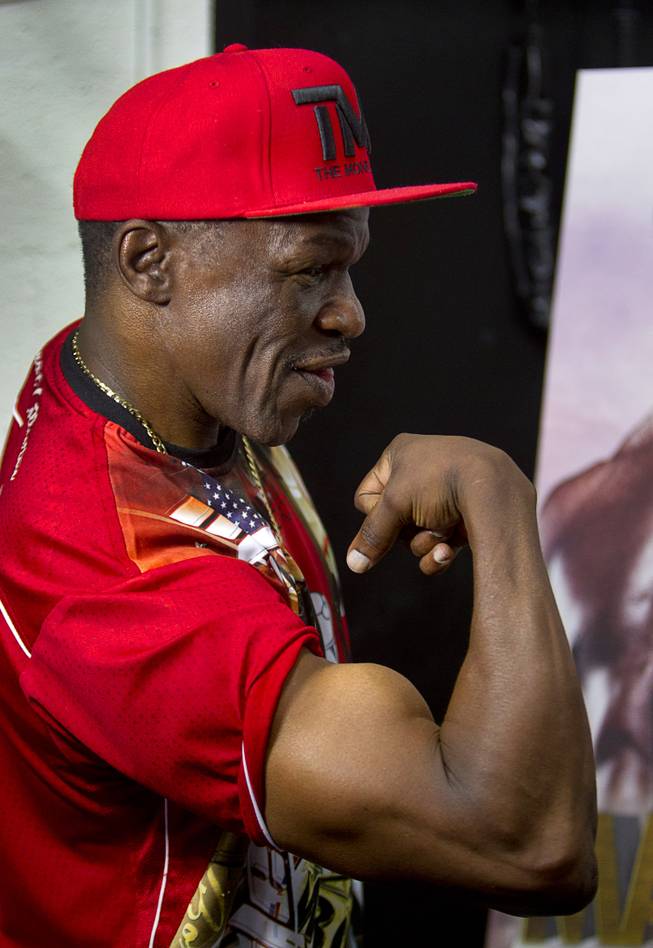 Floyd Mayweather Sr. shows his muscle while being  interviewed during his son's workout at the Mayweather Boxing Club Wednesday, Aug. 26, 2015. Mayweather will defend his WBC and WBA welterweight titles against Andre Berto on Sept. 12 at the MGM Grand Garden Arena.