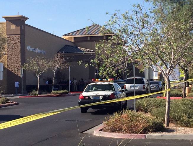 Police blocked off an area outside Wal-Mart on Lake Mead Boulevard near Rancho Drive as they pursued burglary suspects Wednesday, Aug. 26, 2015.