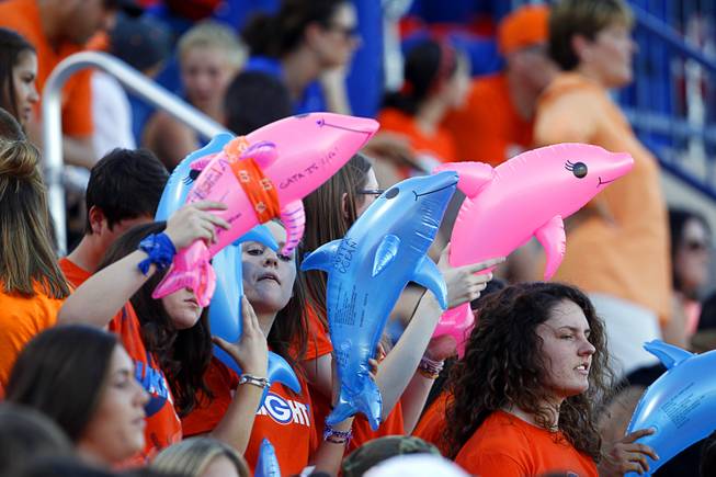 Bishop Gorman High School students hold inflatable shark toys before a game against Chandler (Ariz.) High School at Bishop Gorman Saturday, Aug. 29, 2015. Bishop Gorman beat Chandler 35-14.