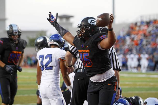 Bishop Gorman High School's Darius Williams (15) celebrates after making the first touchdown during a game against Chandler (Ariz.) High School at Bishop Gorman Saturday, Aug. 29, 2015. Bishop Gorman beat Chandler 35-14.